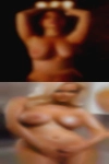 Naked woman lactating